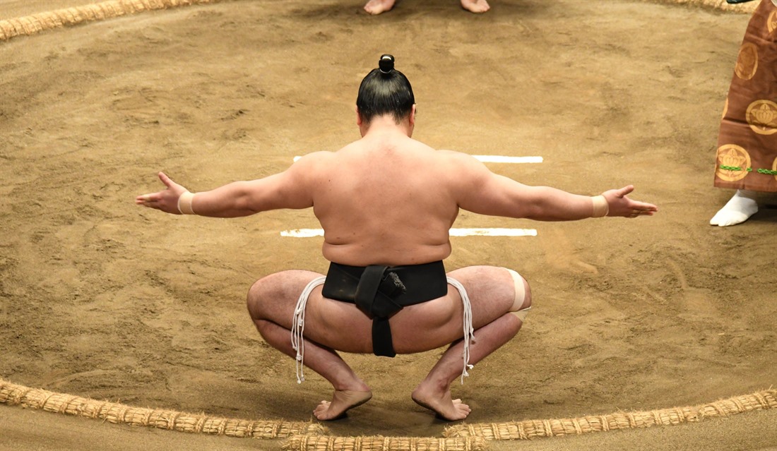 A contestant prepares to take on his rival on the final day of a sumo tournament in Tokyo