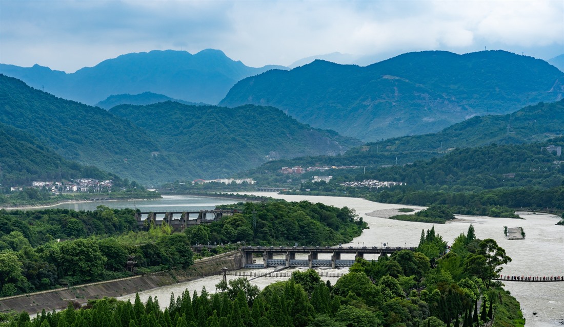 A view of the Dujiangyan Irrigation System and mountain backdrop
