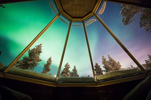 Seeing the Northern Lights through ceiling at Aurora Village