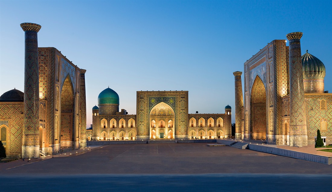 Registan Square at twilight with three madrassahs in Samarkand