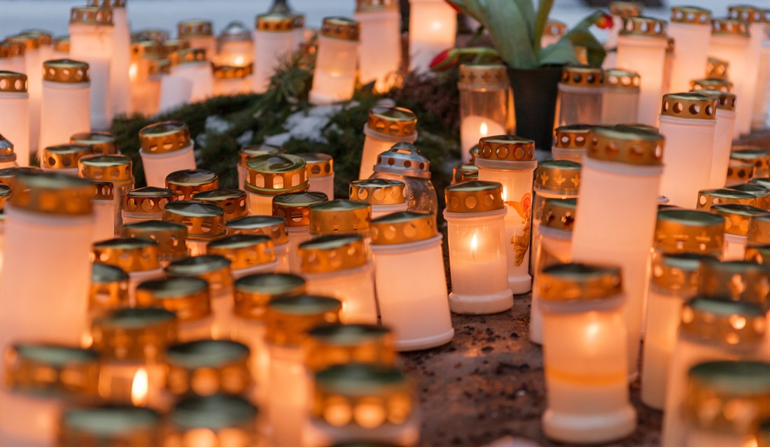 Candles decorate a graveyard in Finland