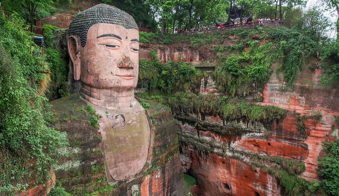 Tourists admire Giant Buddha from the upper viewing deck