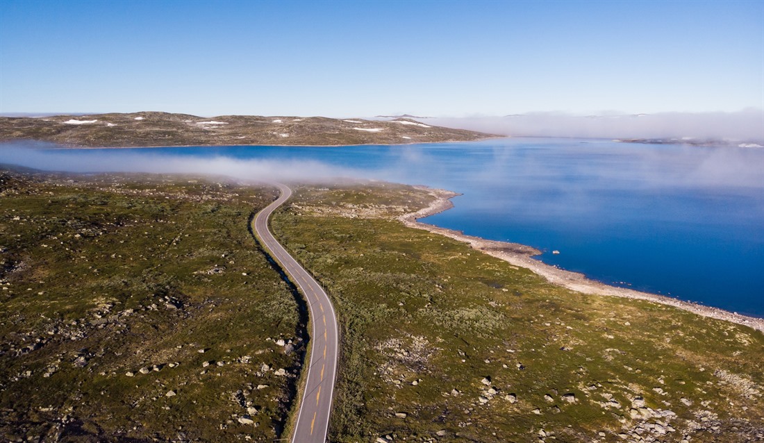 Road across the Hardangervidda Mountain Plateau 