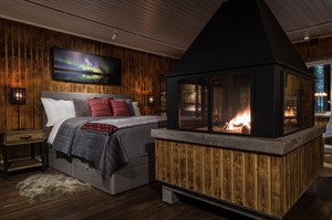 Bedroom by the fire at Logger's Lodge