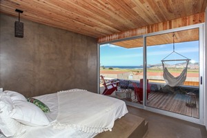Bedroom example at Santa Barbara Eco Beach Resort