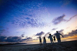 Family on the beach at Rasa Ria Resort