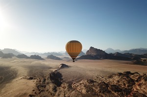 Hot air balloon floating over Wadi Rum