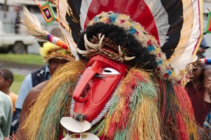 Masked man dancing at Goroka show festival, Papua New Guinea