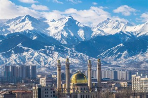 Almaty with snowy background