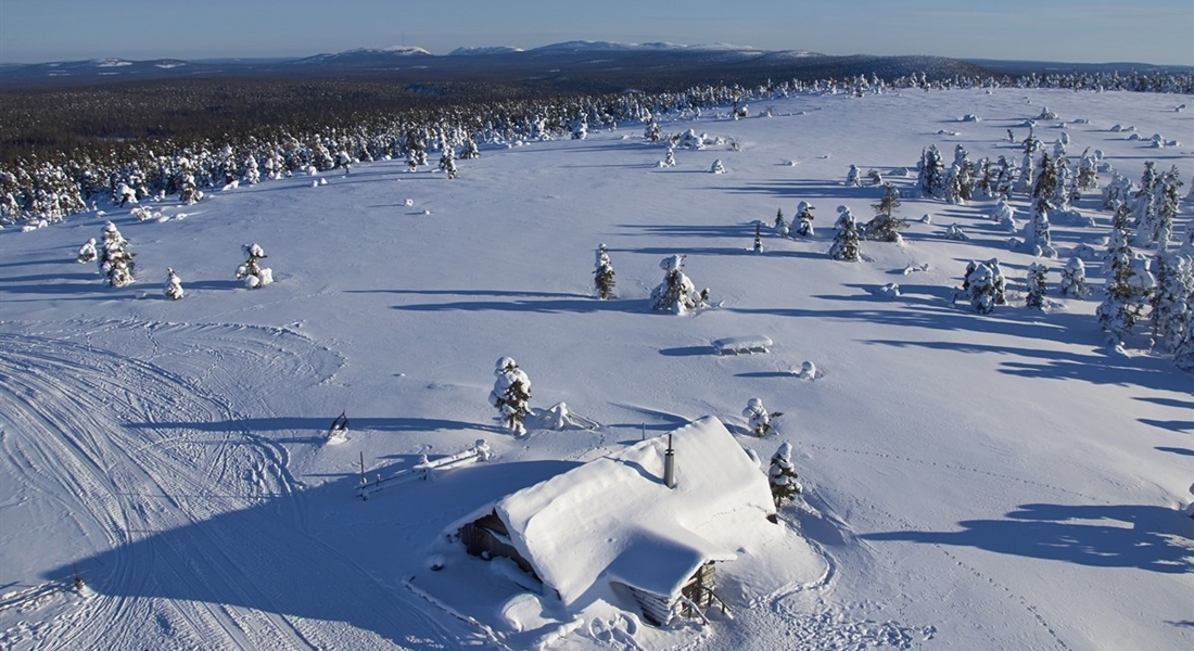 Log cabin in the Finland snow